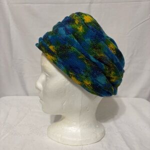 Frank M. Benson fuzzy cap hat in a multi-color design of blues and greens.